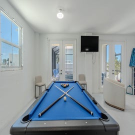 Pool Table with Tv seating etc.