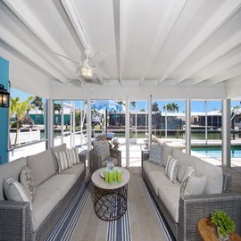 Plenty of seating to relax by the pool.