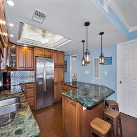 Lovley kitchen with island and barstools.