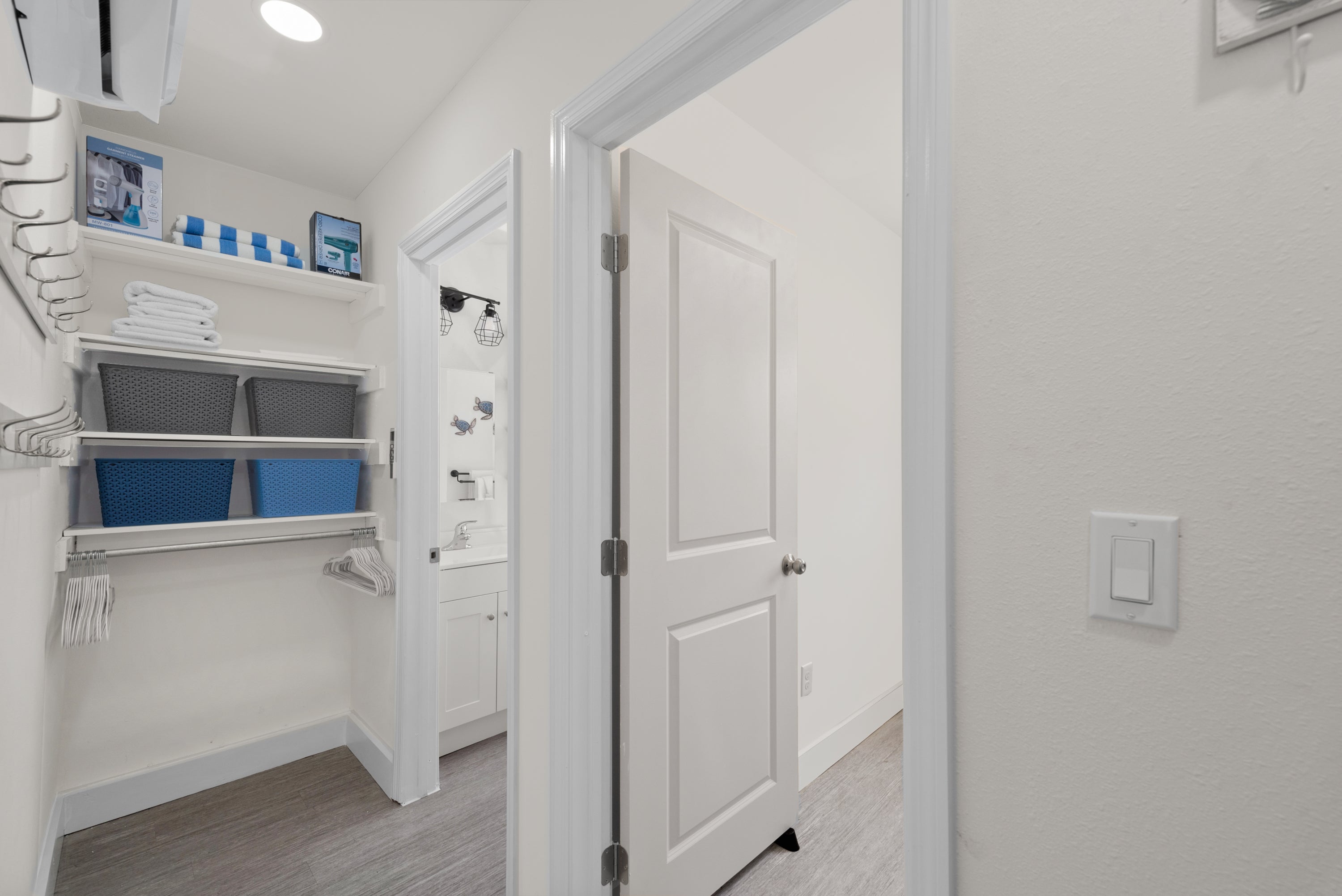 Hallway to Bathroom and office with storage