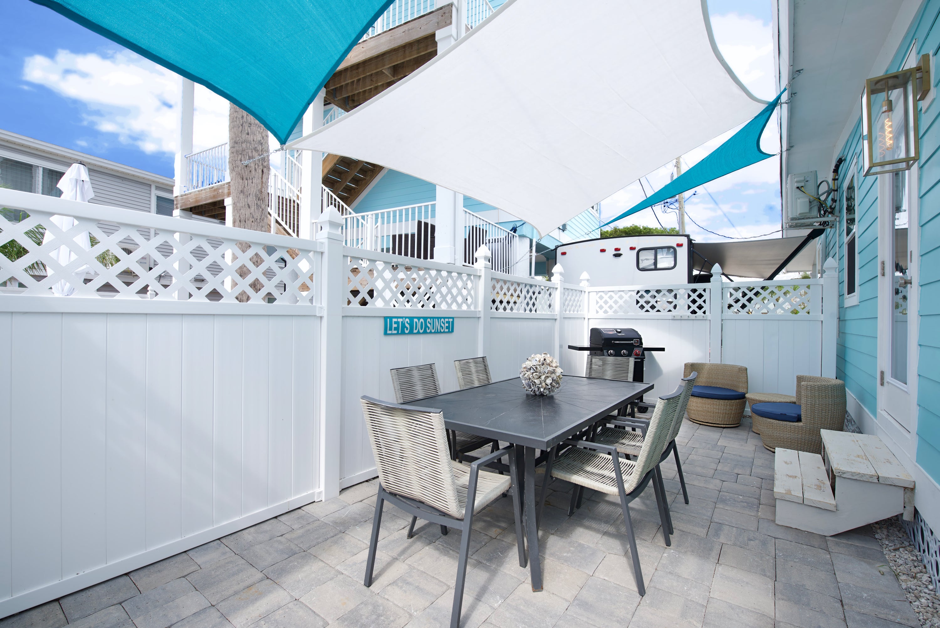 Outdoor dining with grill and seating