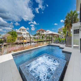 Enjoy the bubbling Spa and views.