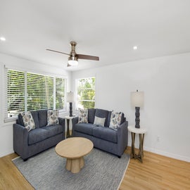 Bright and airy living room with cozy seating.