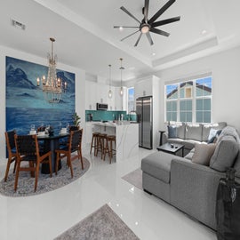 Stunning open coastal living room, dinning, and kitchen.