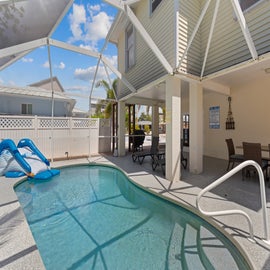 Relax in the refreshing screened in pool!