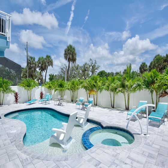 Lounge by the pool in the perfect oasis