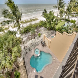 Just steps away to soft sand & gulf water!