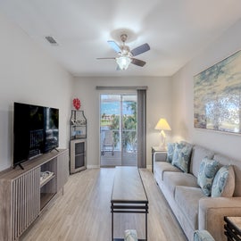 Bright open living room with lake views.