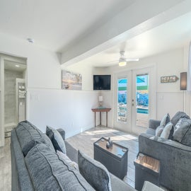 Living room that goes to pool area.