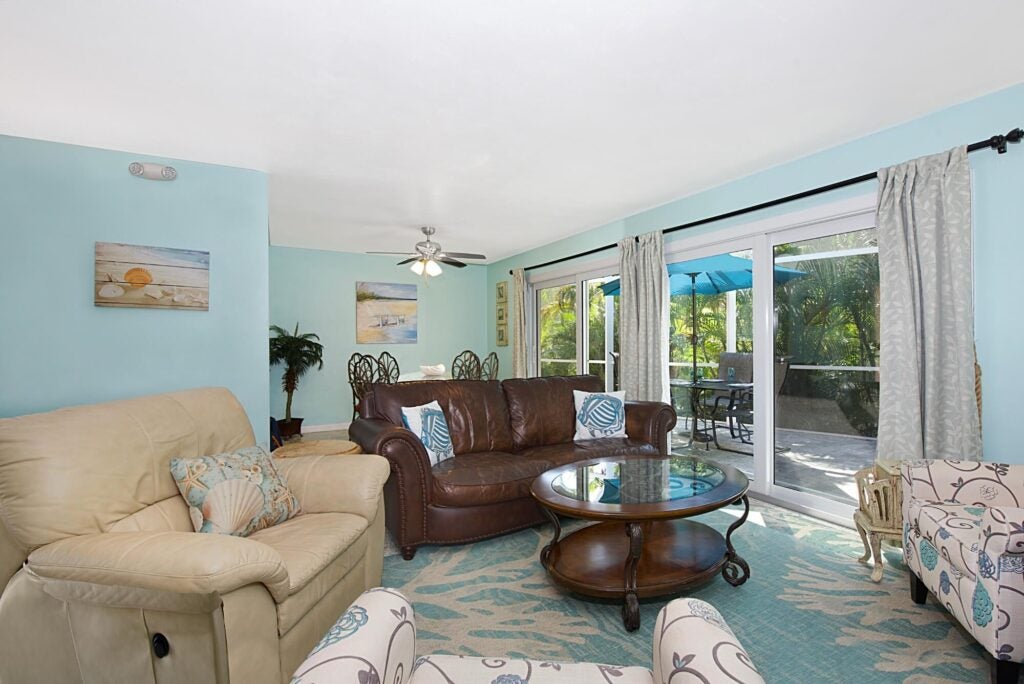 Miramar Palms Fort Myers Beach Vacation Rental Living Room, decorated in blue, tan, and brown.
