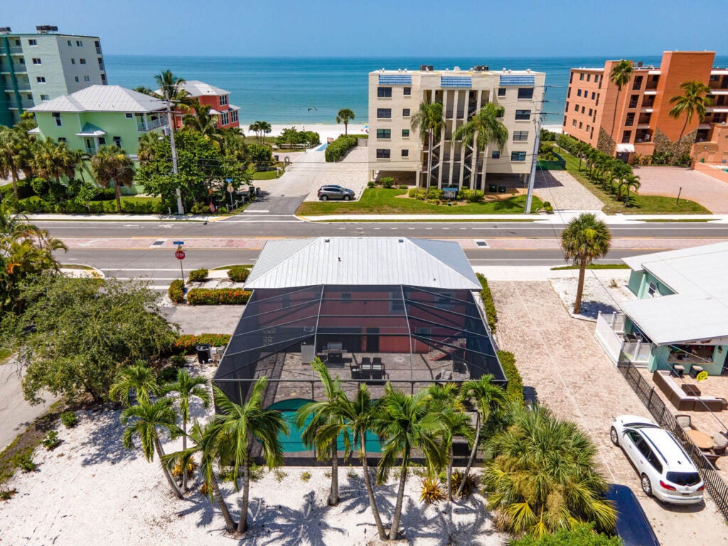 Next-Ta-Sea Fort Myers Beach Vacation Rental Aerial View with beachfront in background.